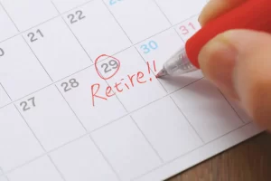 Calendar with the 29th circled in red and the word 'Retire!!' written next to it in red pen