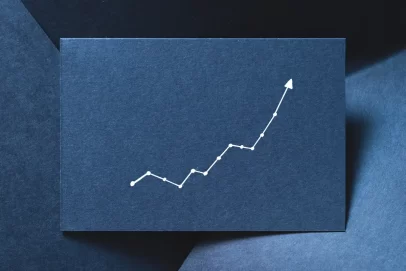 White upward-trending line graph on a dark blue background, symbolizing steady financial growth through small daily savings.